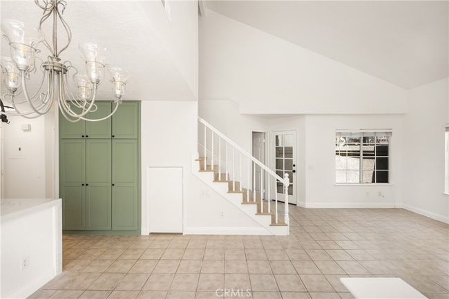 Spacious living area with vaulted ceilings. | Image 6