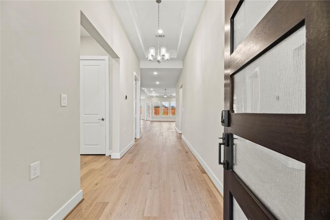 Welcome to your next chapter in Towne Lake’s premier 55+ section! This 3-bedroom, 2.5-bath home with a private study offers sleek, modern finishes from the statement-making front door to the covered back patio, designed for relaxed, low-maintenance living in a vibrant active adult community. | Image 4