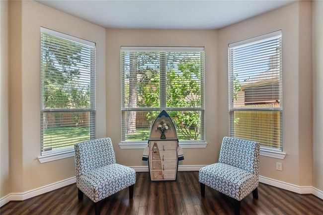 The enjoyable sitting area in the primary bedroom with a dazzling view. | Image 20
