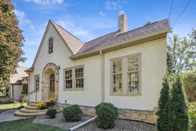 Stunning Crisp exterior.... gorgeous stone work, NEW ROOF, newer windows, gleaming wood floors! | Image 2