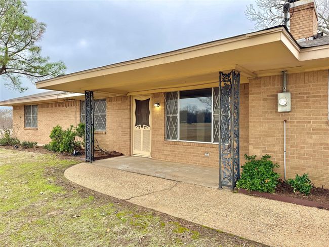 View of exterior entry featuring a patio | Image 5