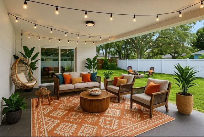 Virtually Staged - This is your first look at what COULD BE the ultimate outdoor hang. The covered patio is a total vibe and a true extension of the living space—whether you’re stringing up lights for a cozy night in or hosting the whole crew. The fully fenced yard (and astro turf side yard) beyond is a blank slate ready for your vision: pool, garden, pets, cornhole tournament—go wild. | Image 40