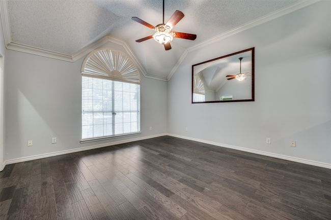 Unfurnished room featuring vaulted ceiling, a ceiling fan, a textured ceiling, and dark wood-type flooring | Image 16