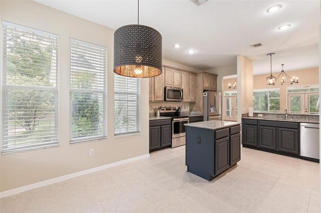 11933 Pasco Trails Blvd, House other with 4 bedrooms, 3 bathrooms and null parking in SPRING HILL FL | Image 11