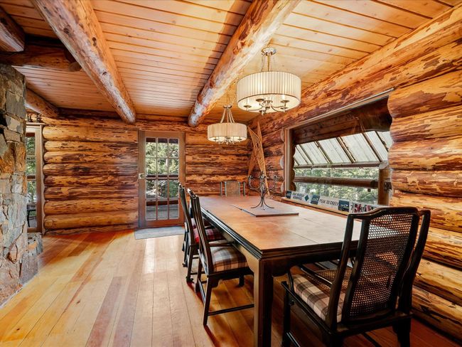 Unfurnished dining area with wooden ceiling, wood-type flooring, and beamed ceiling | Image 10