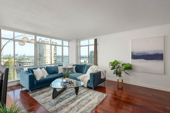 Living room featuring a city view, plenty of natural light, hardwood / wood-style floors, crown molding, and a textured ceiling | Image 6