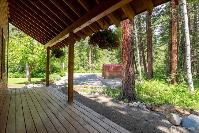 Covered entry porch with seating space | Image 10