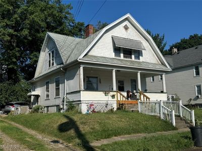 View of front of house featuring a front yard and covered porch | Image 2