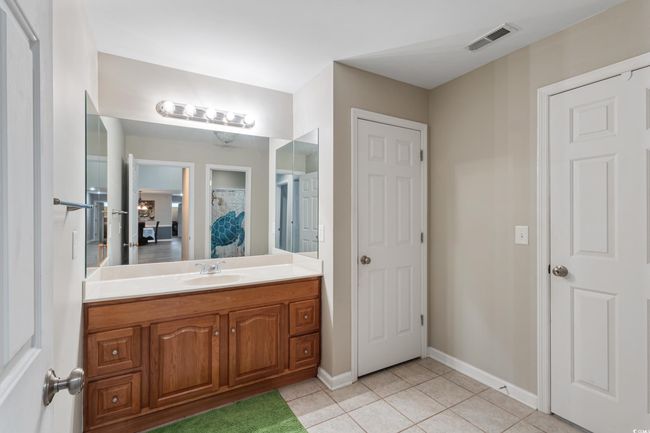 Bathroom with vanity and tile patterned flooring | Image 27