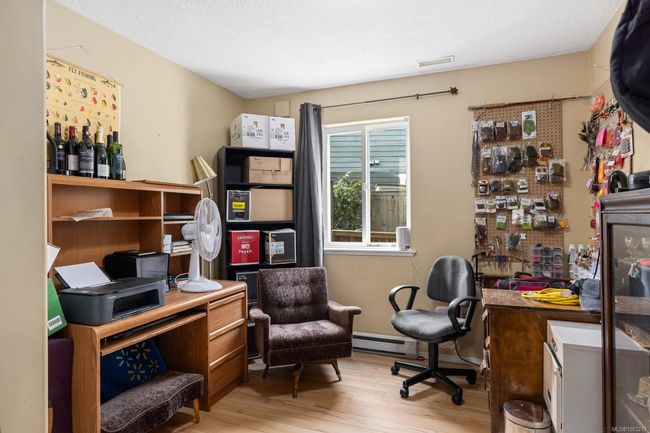 ABOVE GROUND LOWER LEVEL THIRD BEDROOM 10'5X9'10 CURRENTLY USED AS AN OFFICE/WORKSPACE | Image 19