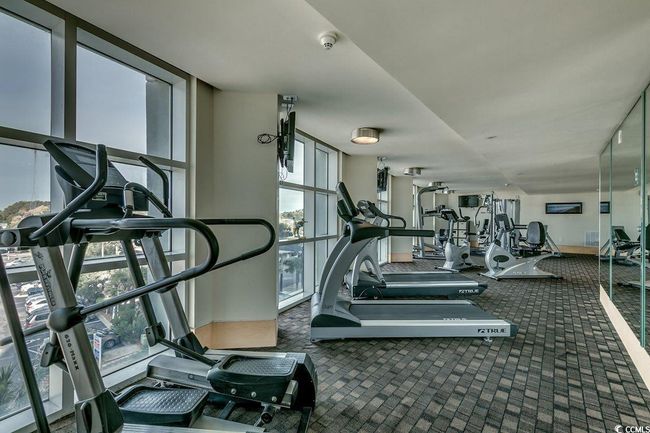 Gym featuring plenty of natural light and carpet floors | Image 27