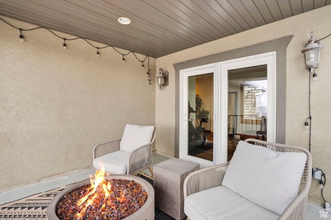 View of patio with an outdoor fire pit | Image 21