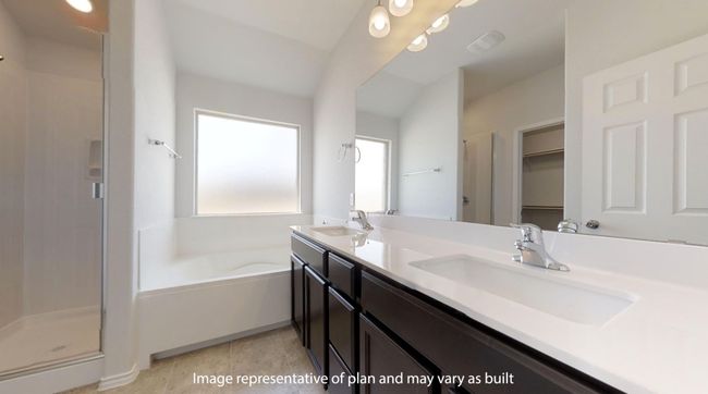 Bathroom with a stall shower, double vanity, a bath, and a walk in closet | Image 17