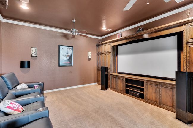 Custom media room downstairs with 107" screen | Image 34
