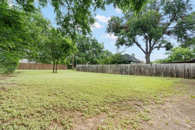 View of fenced backyard | Image 20