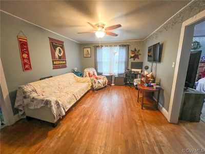 Living room with ornamental molding, ceiling fan, and hardwood / wood-style floors | Image 3