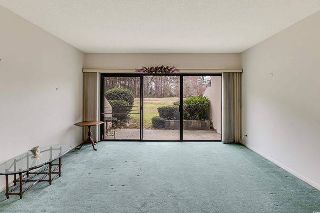 Unfurnished room featuring baseboards and carpet | Image 14