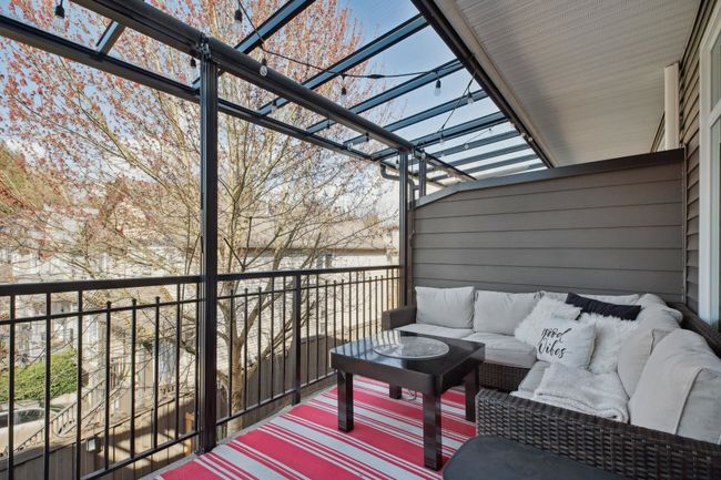 Wooden terrace with an outdoor living space and a pergola | Image 23