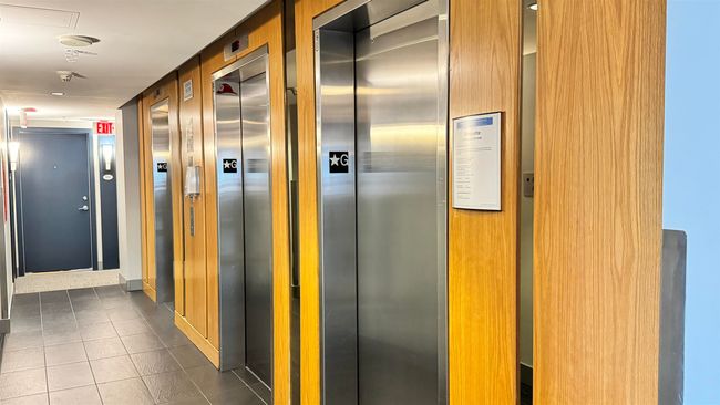 Hall with elevator and dark tile patterned flooring | Image 4