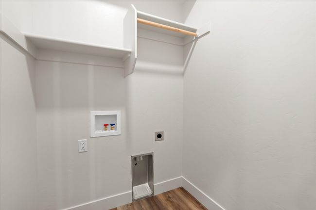 Laundry room featuring wood finished floors, baseboards, laundry area, electric dryer hookup, and washer hookup | Image 23