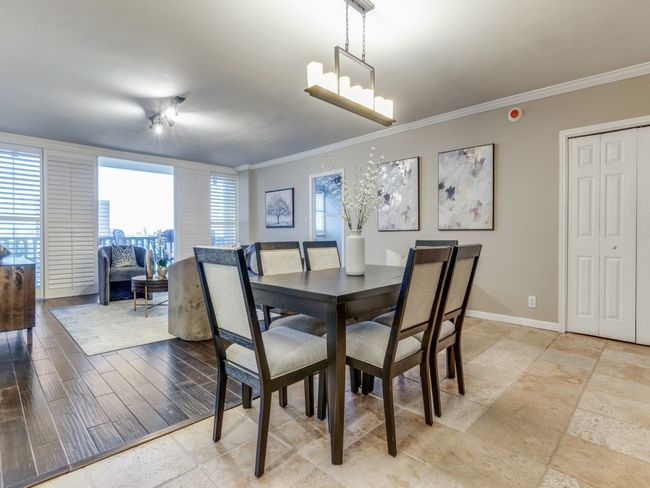 Dining area can easily accommodate generous seating! Plantation shutters, and out to your 11th floor balcony to view Turtle Creek and Dallas Skyline! | Image 5