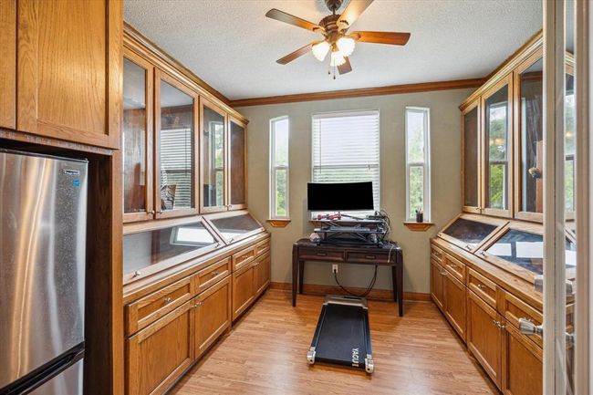 Third office space with unique built in cabinet space upstairs just off the game room on second floor | Image 20
