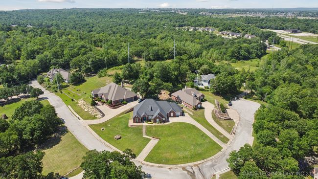 Beautiful neighborhood with mature trees and rolling hills. | Image 56