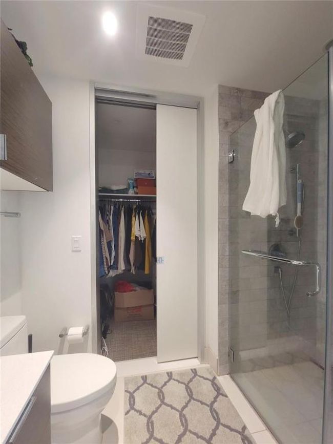 Full bathroom with vanity, a shower stall, and toilet | Image 12