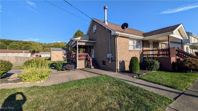 Back of house featuring a yard and a porch | Image 2