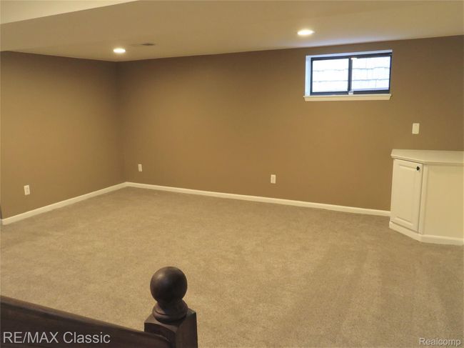 Sprawling recreation|media room finished in top notch materials. | Image 21