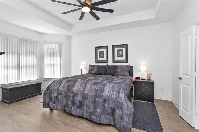 Spacious and serene, the primary suite features a radiant bay window for extra light and charm. The perfect retreat to unwind after a long day. | Image 20