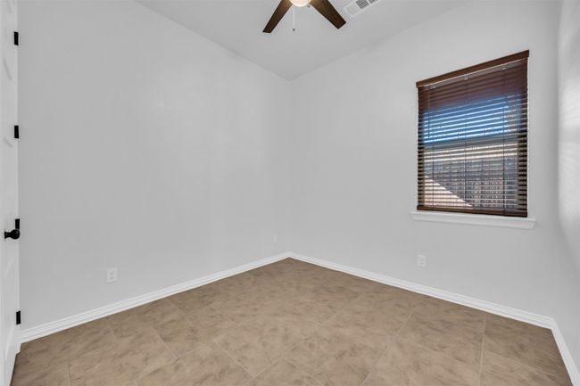 Tiled empty room featuring ceiling fan | Image 21