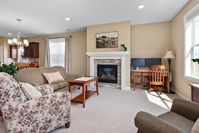 Living Room has beautiful gas fireplace and surround - Open to Dining Room, Kitchen and Sun Room! | Image 10