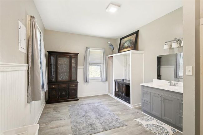 Bathroom with vanity, wood finished floors, and plenty of natural light | Image 17