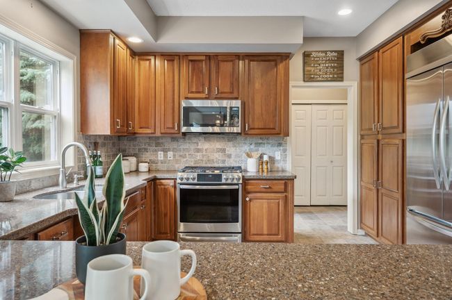 Kitchen with granite countertops and stainless steel appliances | Image 4