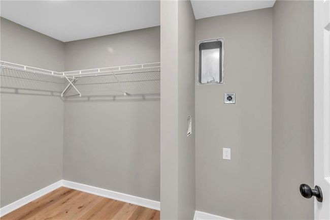 Primary Walk-In Closet with Laundry | Image 16