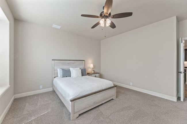 Bedroom featuring carpet and ceiling fan | Image 27