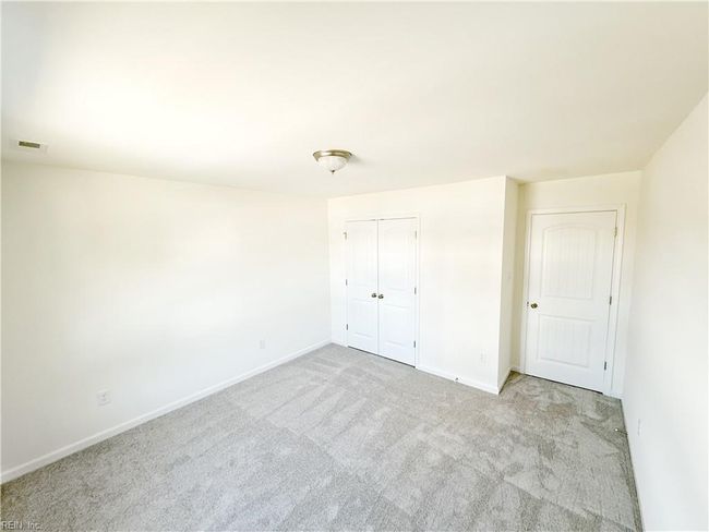 Upstairs you’ll find two additional bedrooms with carpet and double door closets. | Image 12