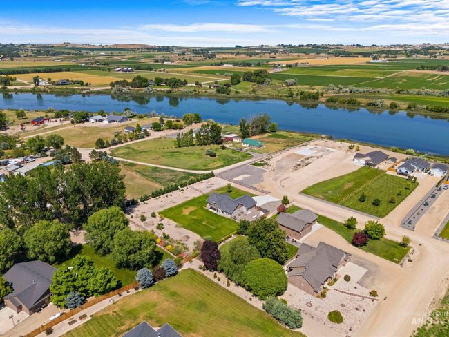 Aerial view of property and surrounding area featuring a large body of water | Image 47