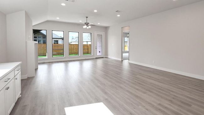 Unfurnished living room with recessed lighting, light wood-type flooring, and ceiling fan | Image 9