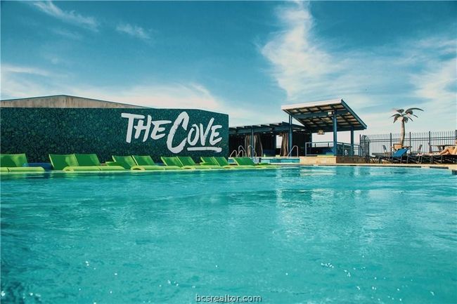 Community pool featuring fence | Image 24
