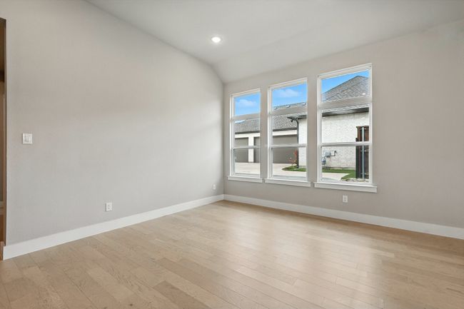 Dining room with light wood-style floors, lofted ceiling, and recessed lighting | Image 10