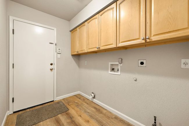utility room with storage and plumbed for gas and electric dryer | Image 27