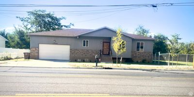 View of front of property featuring a garage | Image 1