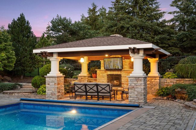 Pool pavilion is wired for a tv and features a wood burning fireplace. Soak in the pool while watching the game! | Image 72