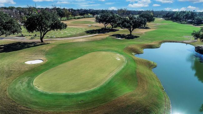 Enjoy the beauty and challenge of Sugar Creek’s premier 27-hole golf course. Designed for players of all skill levels, this meticulously maintained course offers lush fairways, scenic water features, and top-tier practice facilities, including a driving range and putting greens. Whether you're perfecting your game or simply enjoying the breathtaking views, Sugar Creek delivers an exceptional golf experience in the heart of Sugar Land. | Image 50