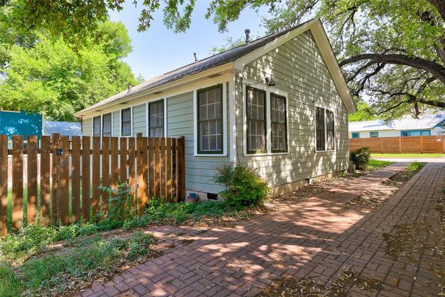 View of home's exterior with a patio area and fence | Image 22
