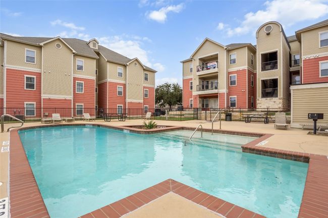 Pool featuring a patio and fence | Image 5