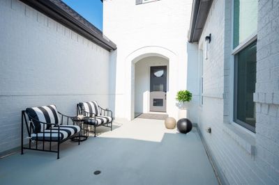 Private, gated entry courtyard with access to main house and casita guest quarters. | Image 3