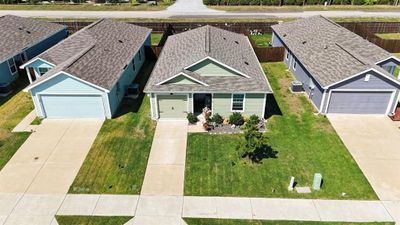 View of front of property with a front lawn and central AC | Image 3